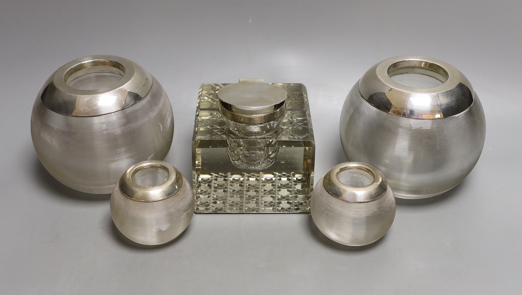 Two pairs of early to mid 20th century silver mounted ribbed glass match tidies, largest height 11cm and a silver mounted glass inkwell.